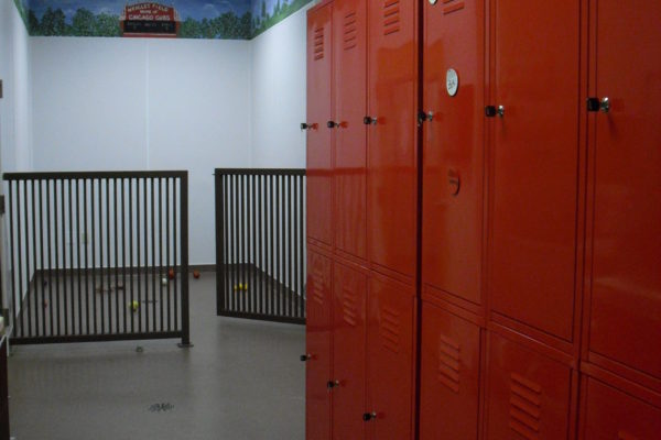 We have boarding for both dogs and cats. This shows the lockers where we keep pet's food, treat and personal items. A playpen can be seen in the background. Each pet gets on-on-one time with a staff member. They can play catch, tug-of-war, or just sit on the floor and cuddle.